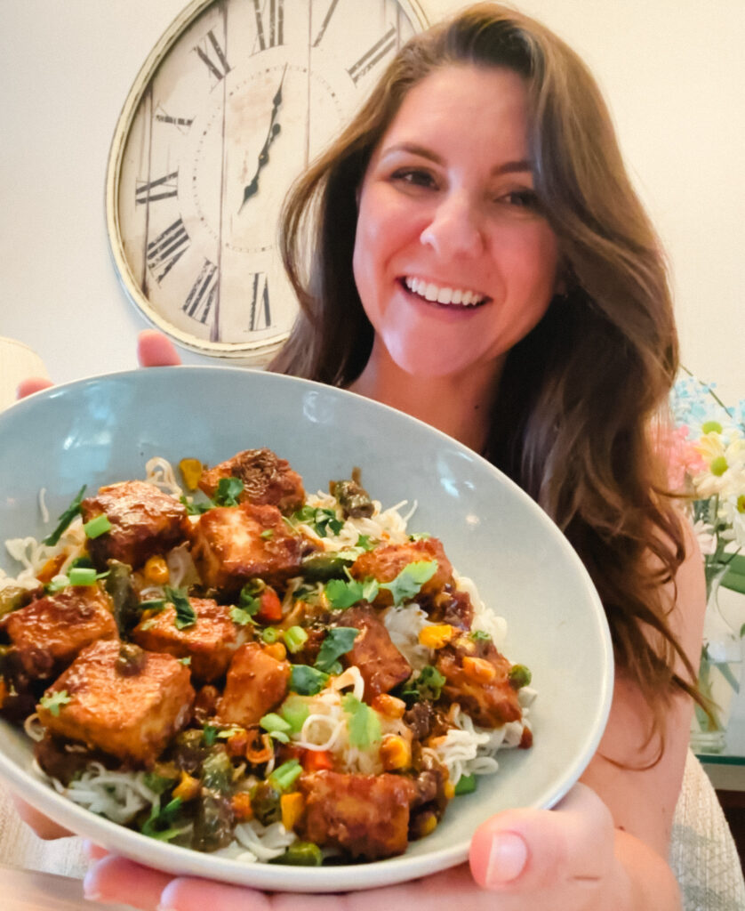 myplantbasedfriend holding tofu peanut noodles